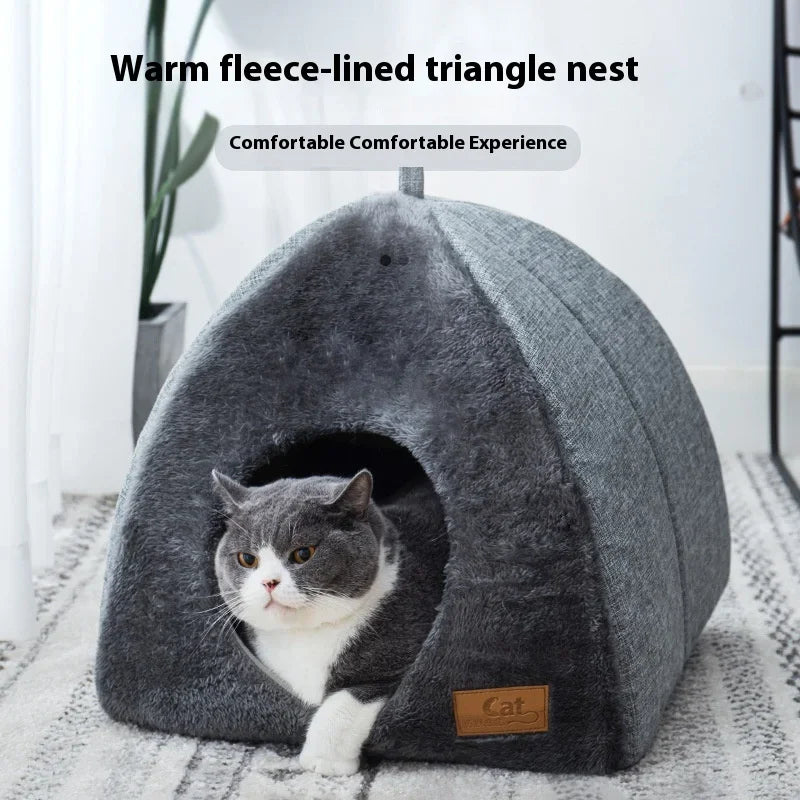 Gray triangle cat nest with white cat peeking out warm fleece lined pet bed