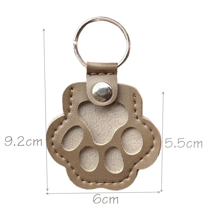 Khaki leather paw keychain with textured finish fur compartment