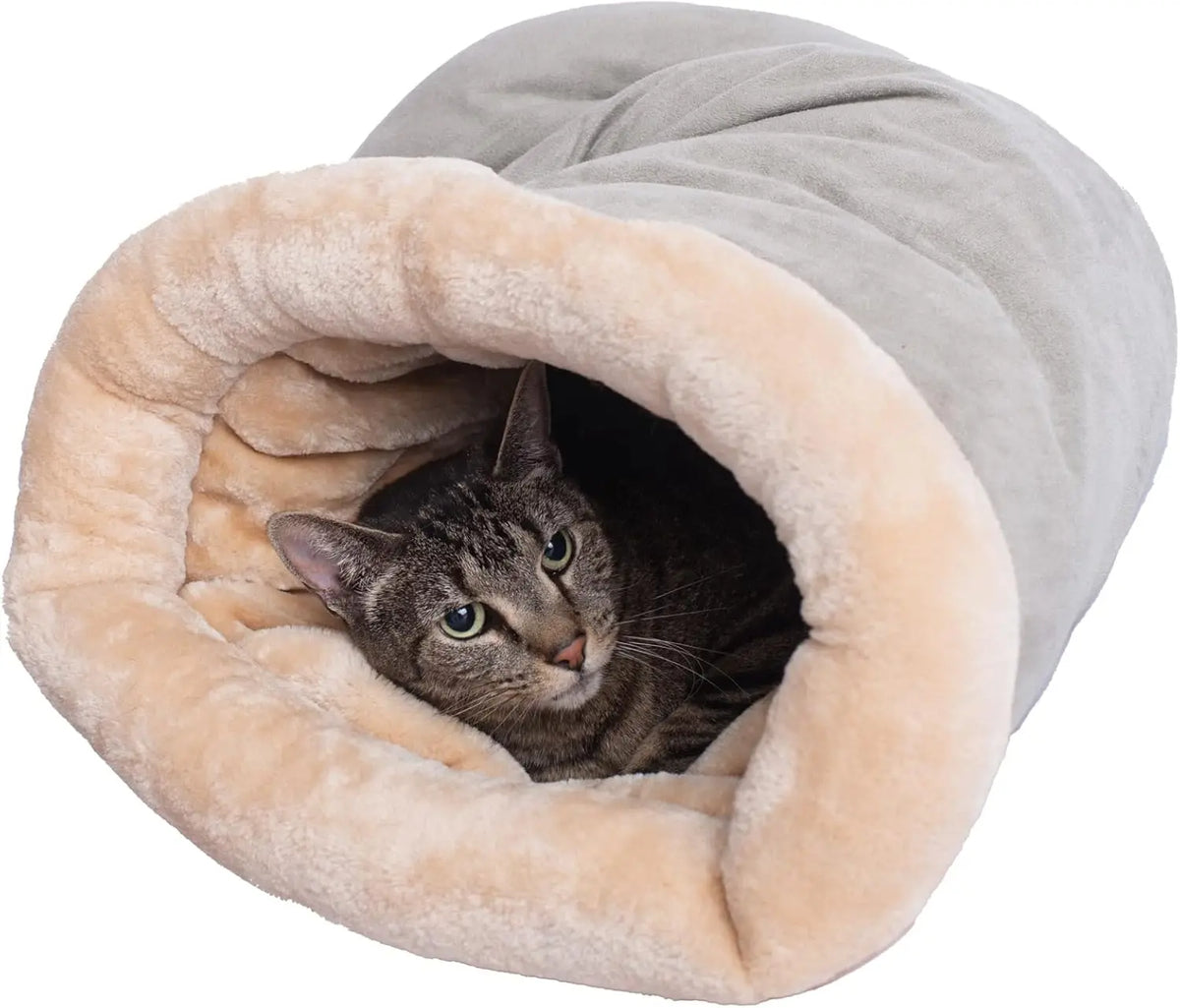 Cat peeking out of cozy winter sleeping bag tunnel bed