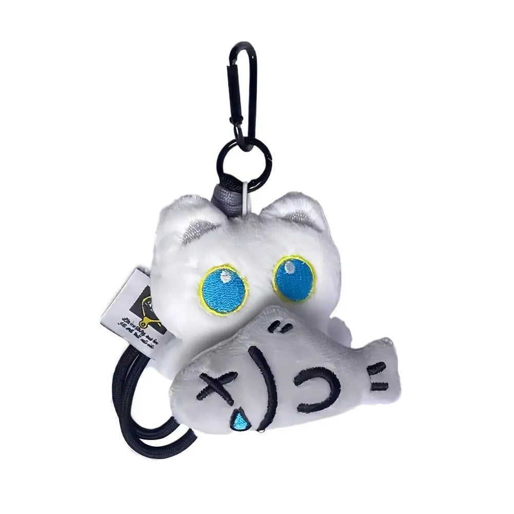 White plush cat keychain with ghost fish charm