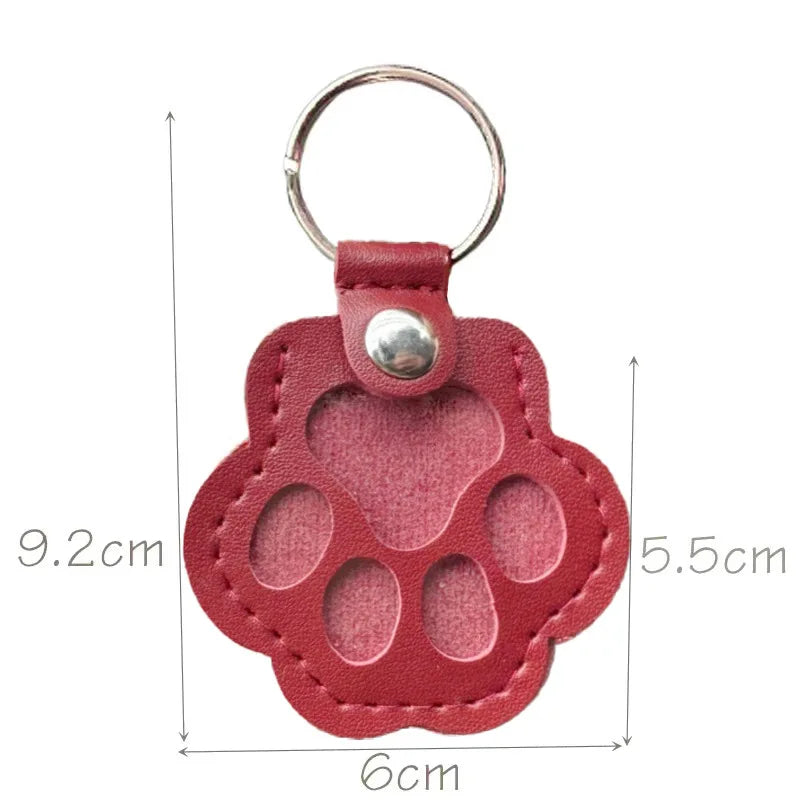 Red leather paw keychain with textured finish fur compartment