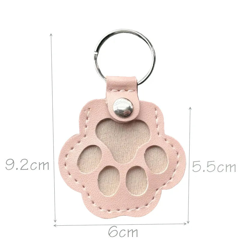 Pink leather paw keychain with textured finish fur compartment