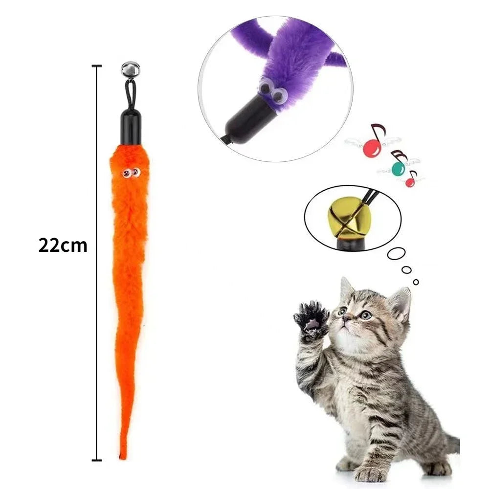 Gray kitten reaching for orange worm toy showing retractable wand design