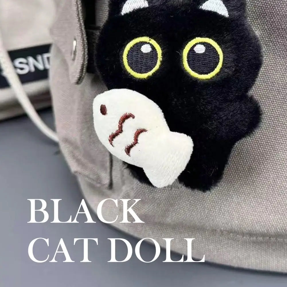 Black cat doll plush keychain with ghost charm on bag