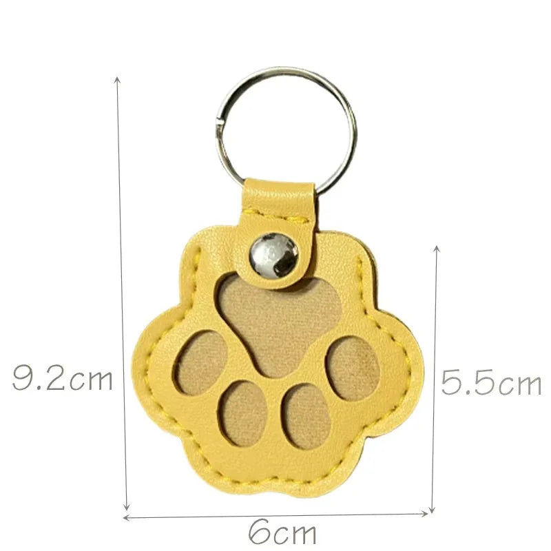Yellow leather paw keychain with textured finish fur compartment
