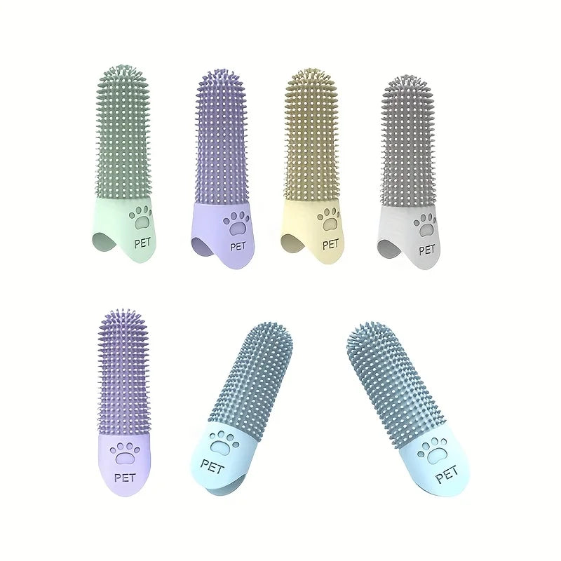 Hand holding blue silicone finger toothbrush showing 360 degree bristles all colors