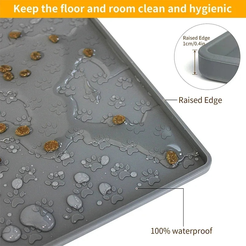 Gray silicone pet placemat with raised edge containing water and food spills