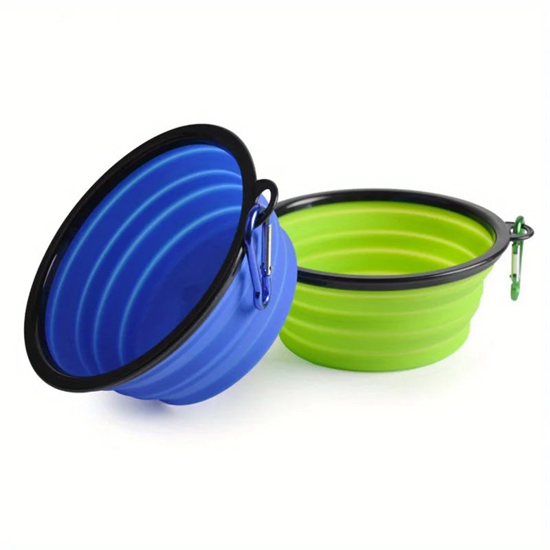 Blue and green collapsible silicone bowls with black rims side view
