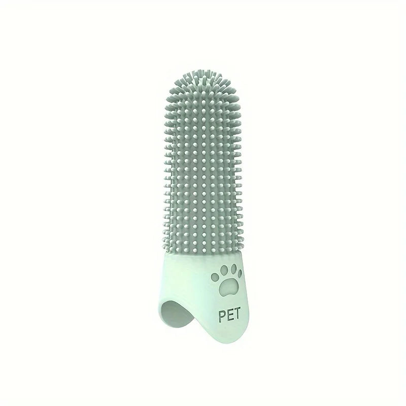 Green silicone finger toothbrush displayed on white background
