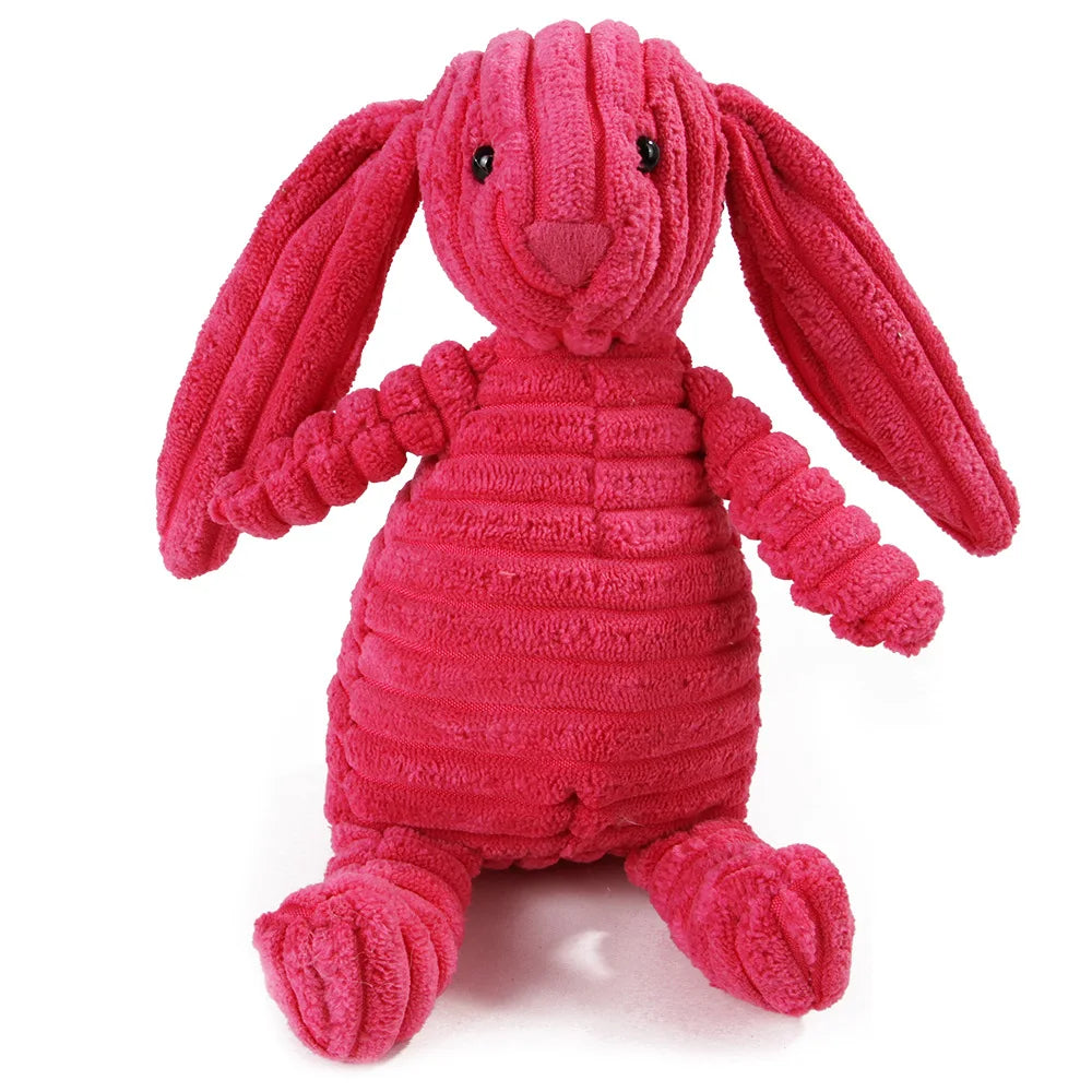 Pink plush rabbit dental chew toy for dogs