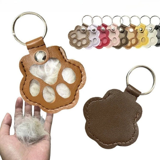Hands opening leather paw keychain to add pet fur keepsake memory