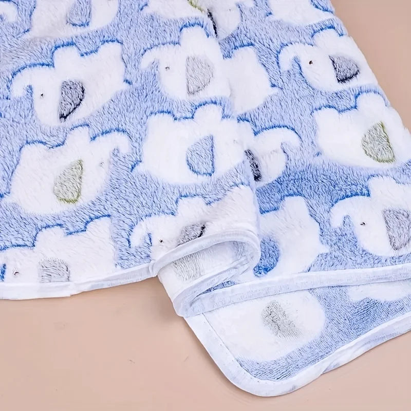 Close up of plush flannel fabric with cute elephant print pet blanket