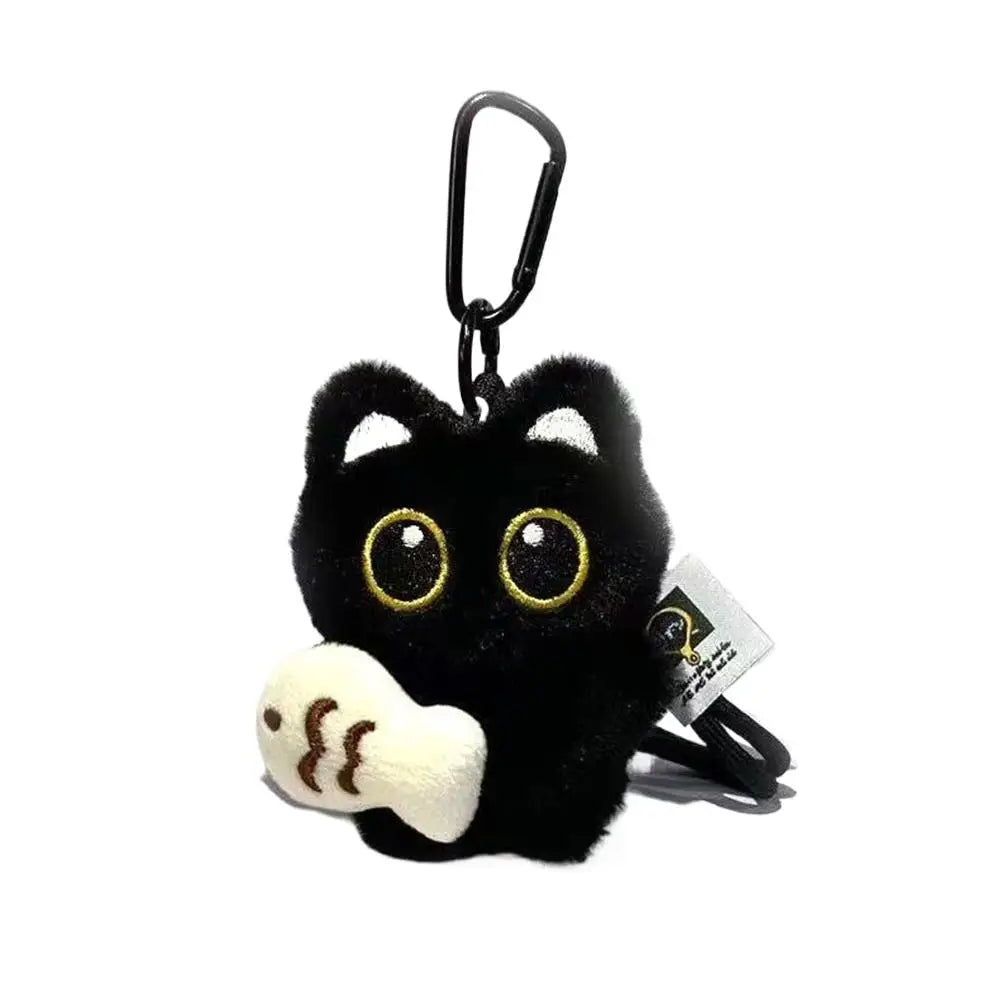 Black plush cat keychain with white paw charm