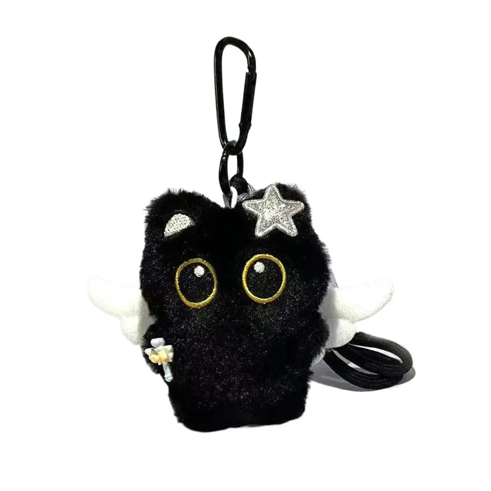Black plush cat keychain with star patch and tail