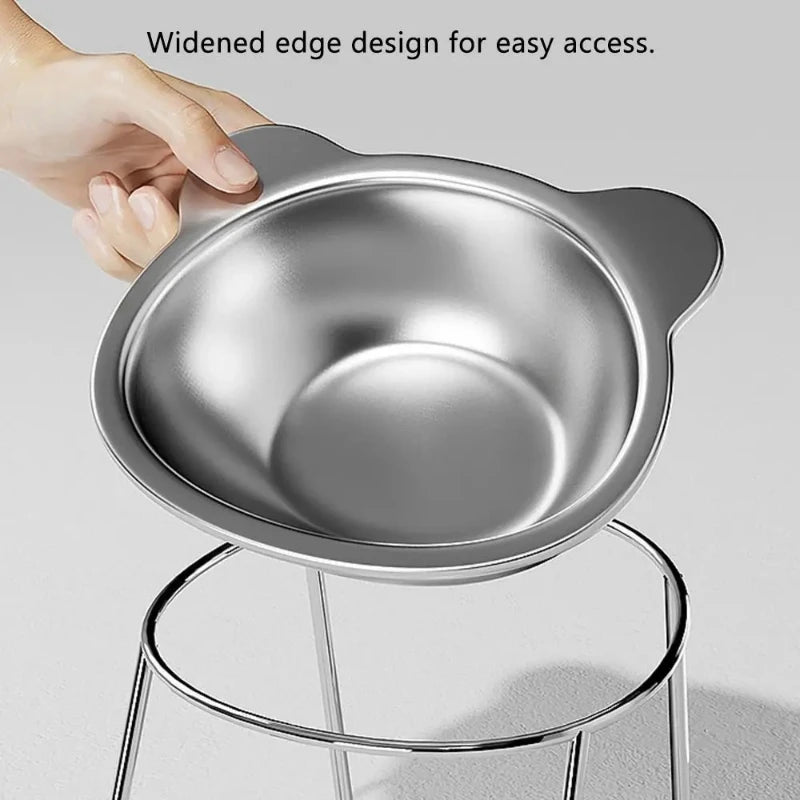 Hand holding elevated cat bowl with widened edge and cat ear design