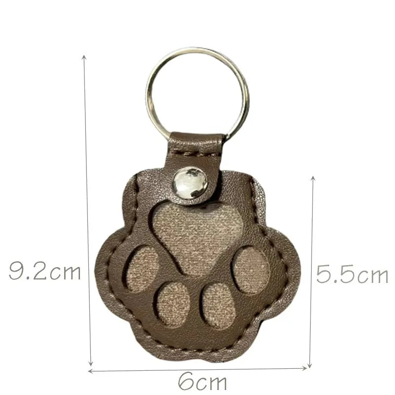 Dark brown leather paw keychain with textured finish fur compartment