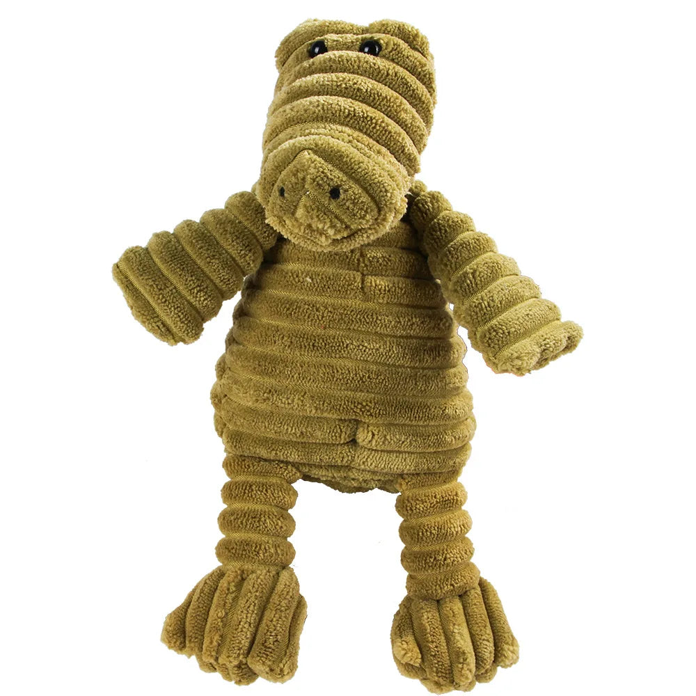 Green plush alligator dental chew toy for dogs