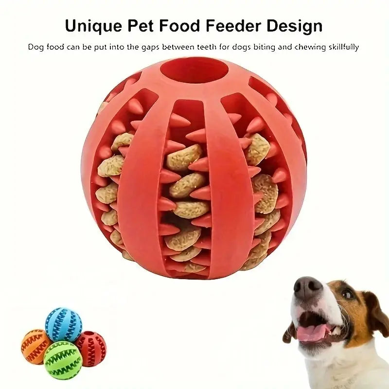 Red treat dispenser chew ball filled with kibble and happy jack russell terrier