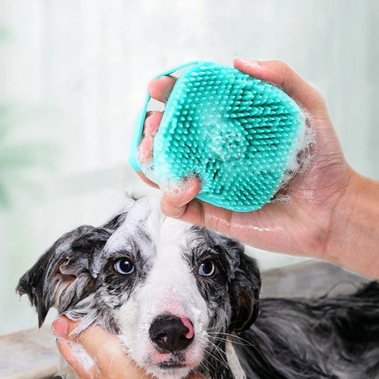 Person bathing dog with green silicone brush gentle pet spa tool