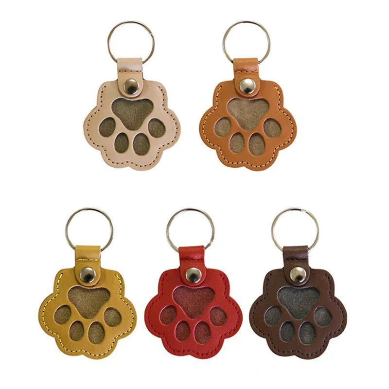 Five colors leather paw keychains displayed in row keepsake collection