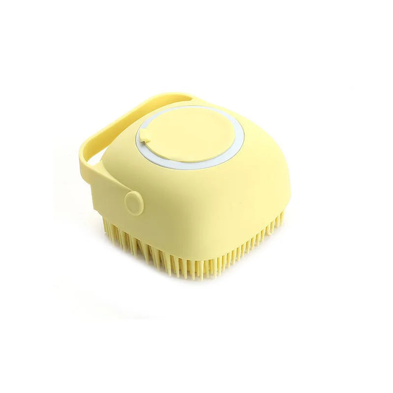 Yellow silicone pet bath brush displayed on white background