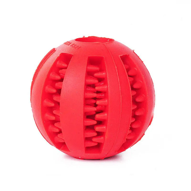Red rubber treat ball with textured grooves for dental cleaning and slow feeding