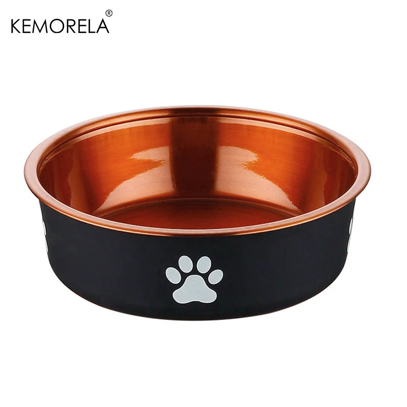 Black dog bowl with copper gold interior and white paw print side angle