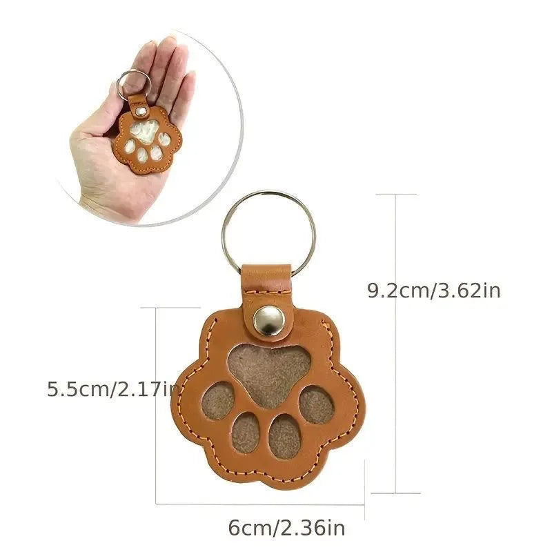 Hand Brown leather paw keychain with textured finish fur compartment