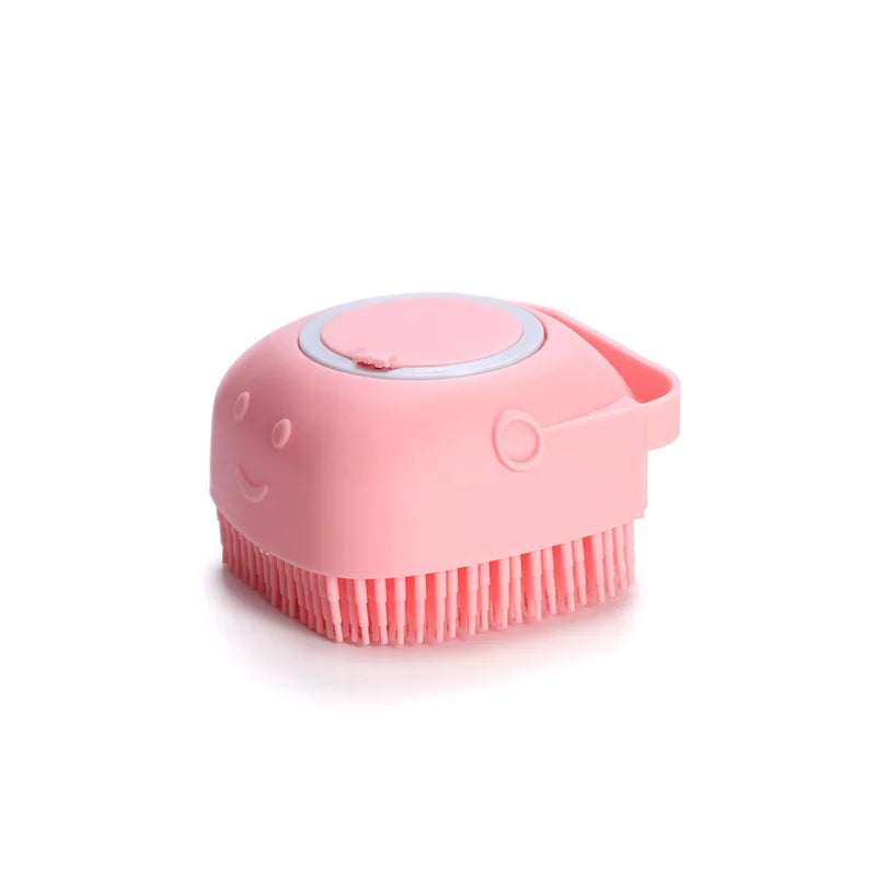 Pink silicone pet bath brush displayed on white background