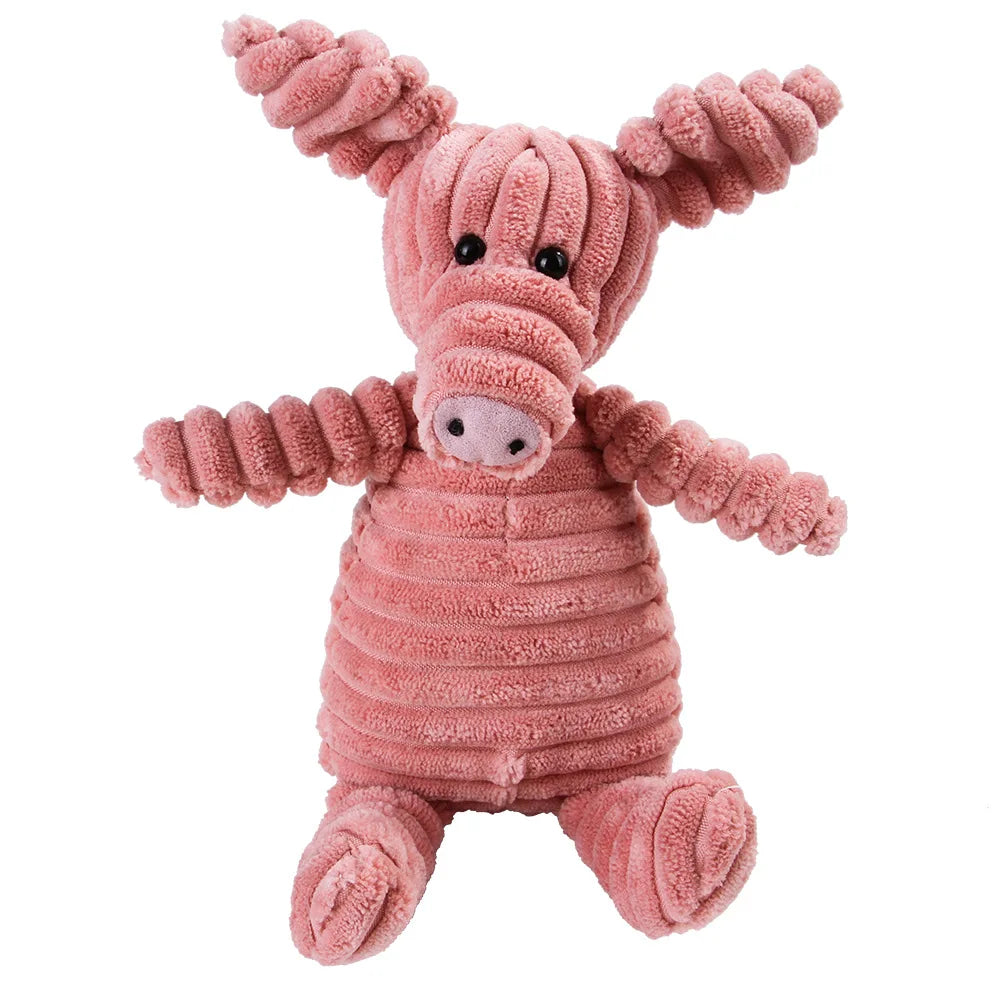 Pink plush pig dental chew toy for dogs