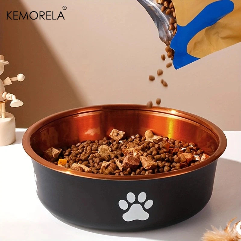 Blue scoop pouring kibble into black and copper dog bowl with paw print